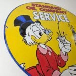Vintage Standard Gasoline Sign – Gas Oil Pump Plate Porcelain Walt Disney Sign - Image 10